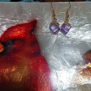Amethyst color glass stone earrings in gold finish